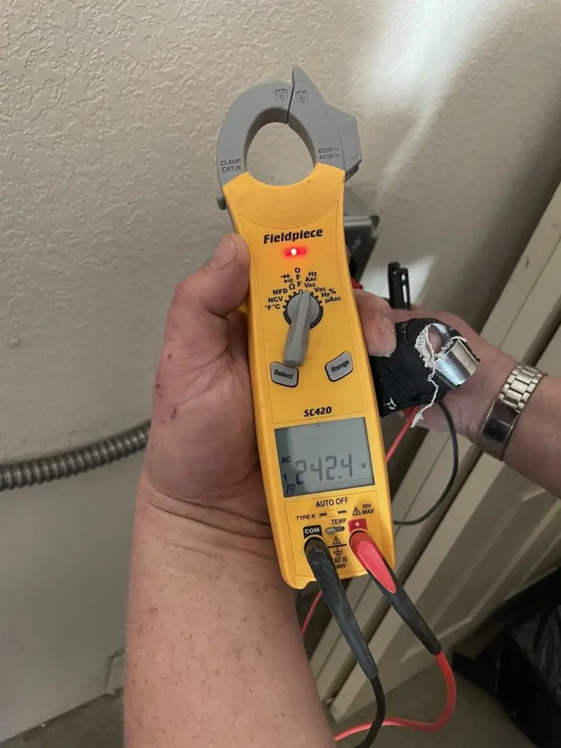 Voltage testing with clamp meter during Whole House Surge Protector in Paxton